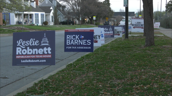 Candidates’ signs line the outside of the polling location at Paschal High School.